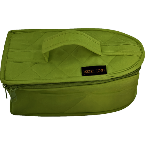 a green bag sitting on top of a green suitcase 