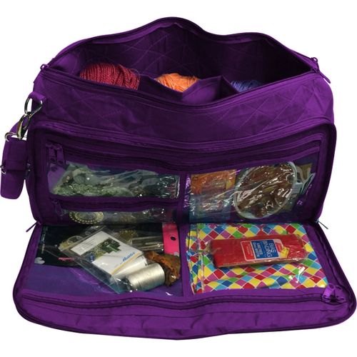 a suitcase is packed with clothes and other items 