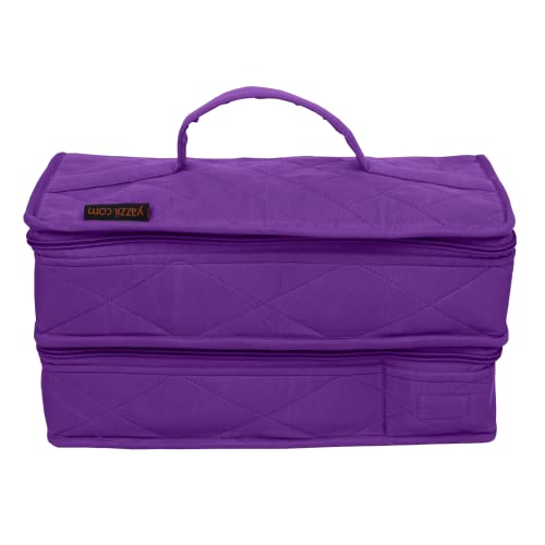 a purple piece of luggage sitting on a white surface 