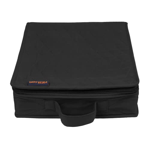 a black piece of luggage sitting on top of a table 