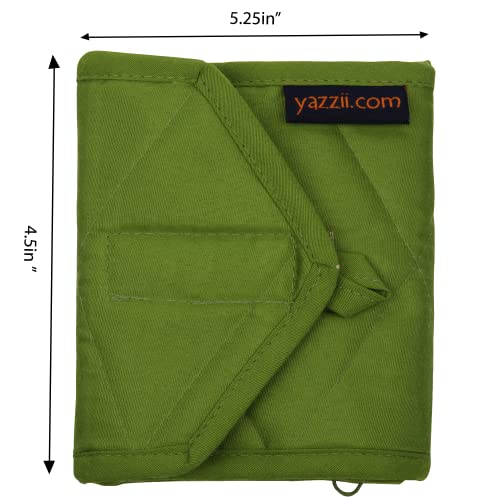 a picture of a bed with a green cover 