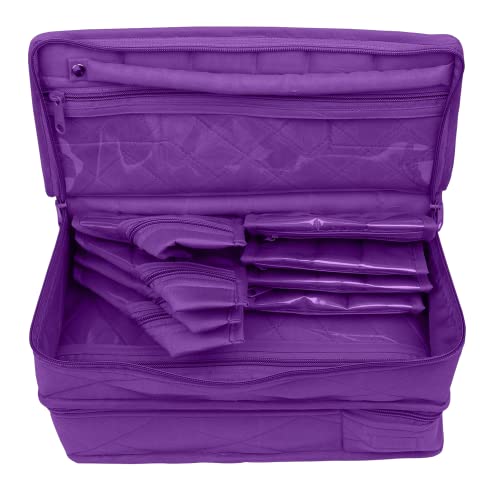 a purple suitcase is sitting on a white surface 