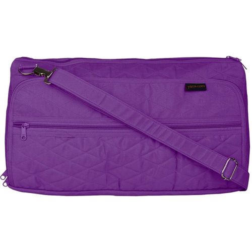 a purple suitcase with a purple blanket on it 